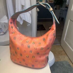 Dooney and bourke hand bag. Pretty pink and very gently used.
